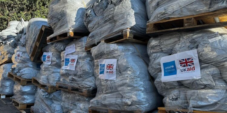 Bales of donated tents stacked in Gaza during the Gaza ceasefire
