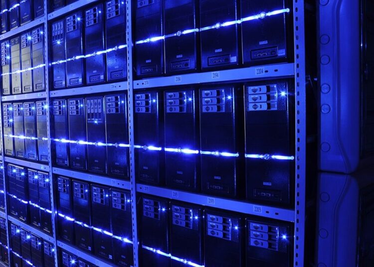 Rows of illuminated server racks in a data center, representing the Ankara data center project
