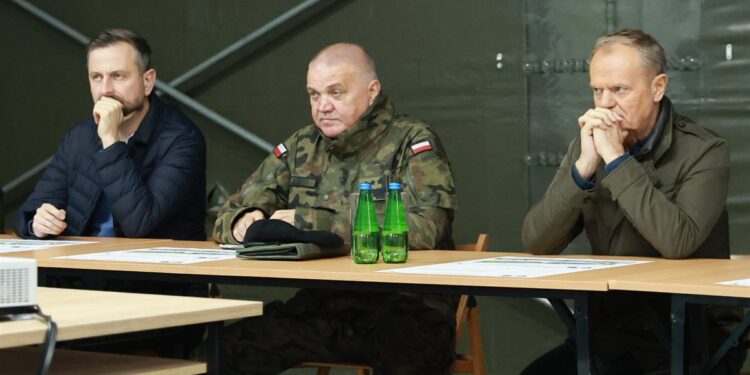 Donald Tusk, right, and Defense Minister Wladyslaw Kosiniak-Kamysz, left, at a briefing in Poland